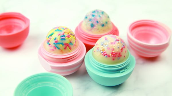 This DIY cupcake lip balm will sprinkle your lips with sweet birthday flavors #DIY #crafts #lipbalm